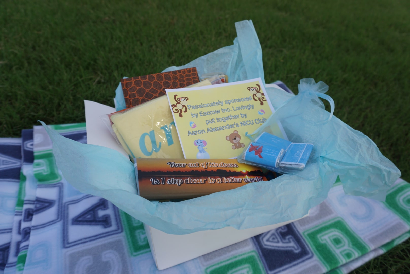 Baby care package arranged on a blanket